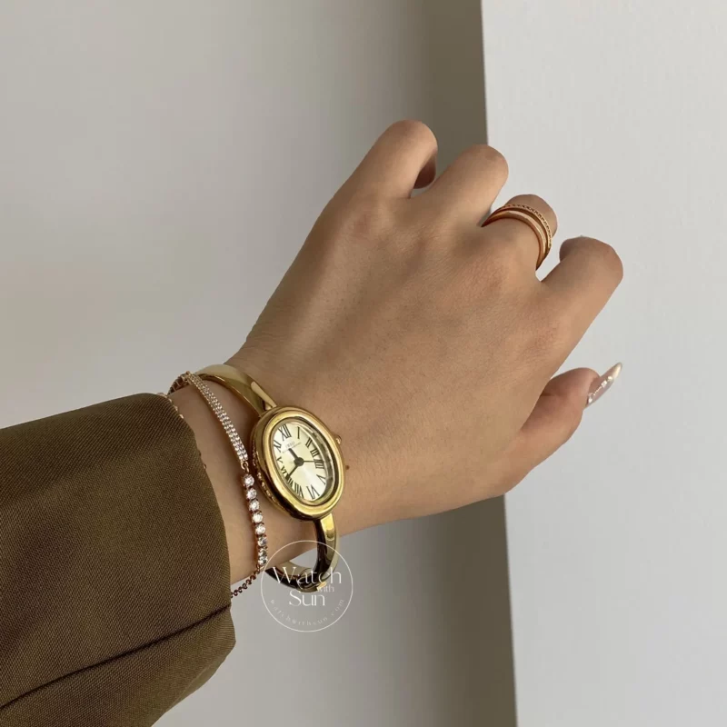 Vintage Gold Oval Watch for Women Roman Numeral Dial Bangle Watch