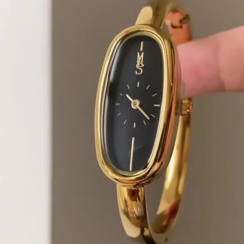 Elegant Oval Black Dial Wristwatch Gold Bangle Watch for Women