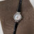 Dainty Mother of Pearl Round Face Black Leather Watch