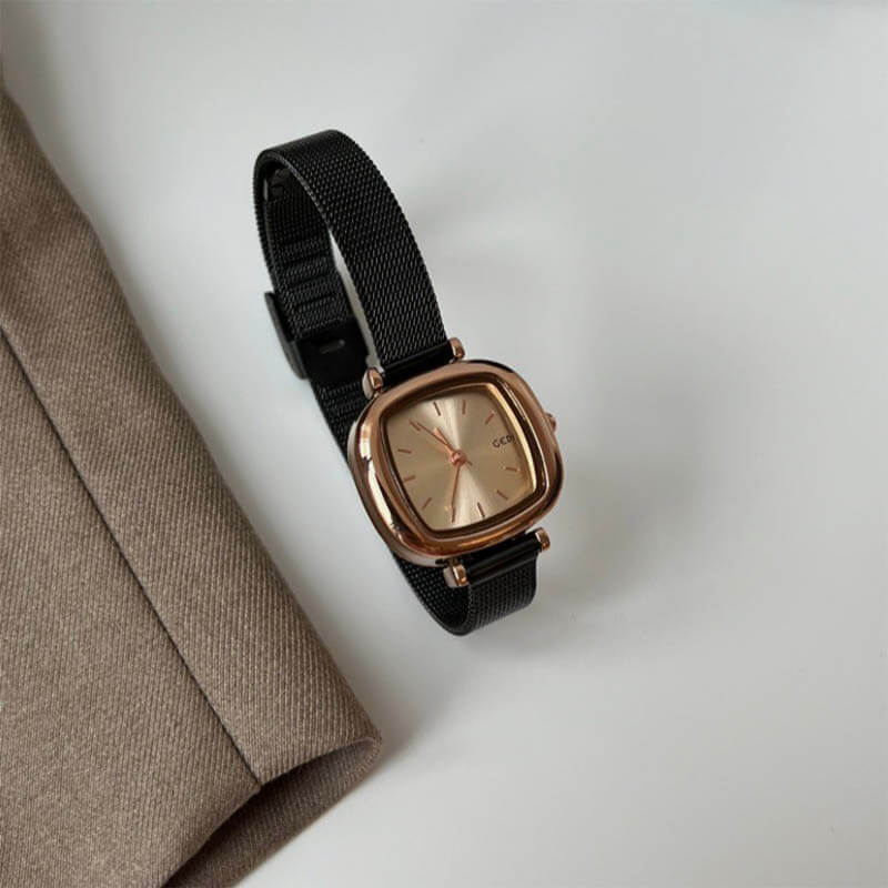 rose gold color case with black band