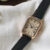 Brown square face watch with black band