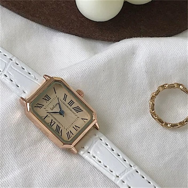 Brown square face watch with white band