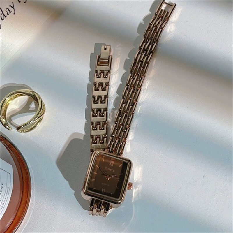 Square face watch with brown case