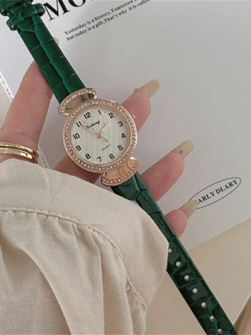 Small round face watch with green leather