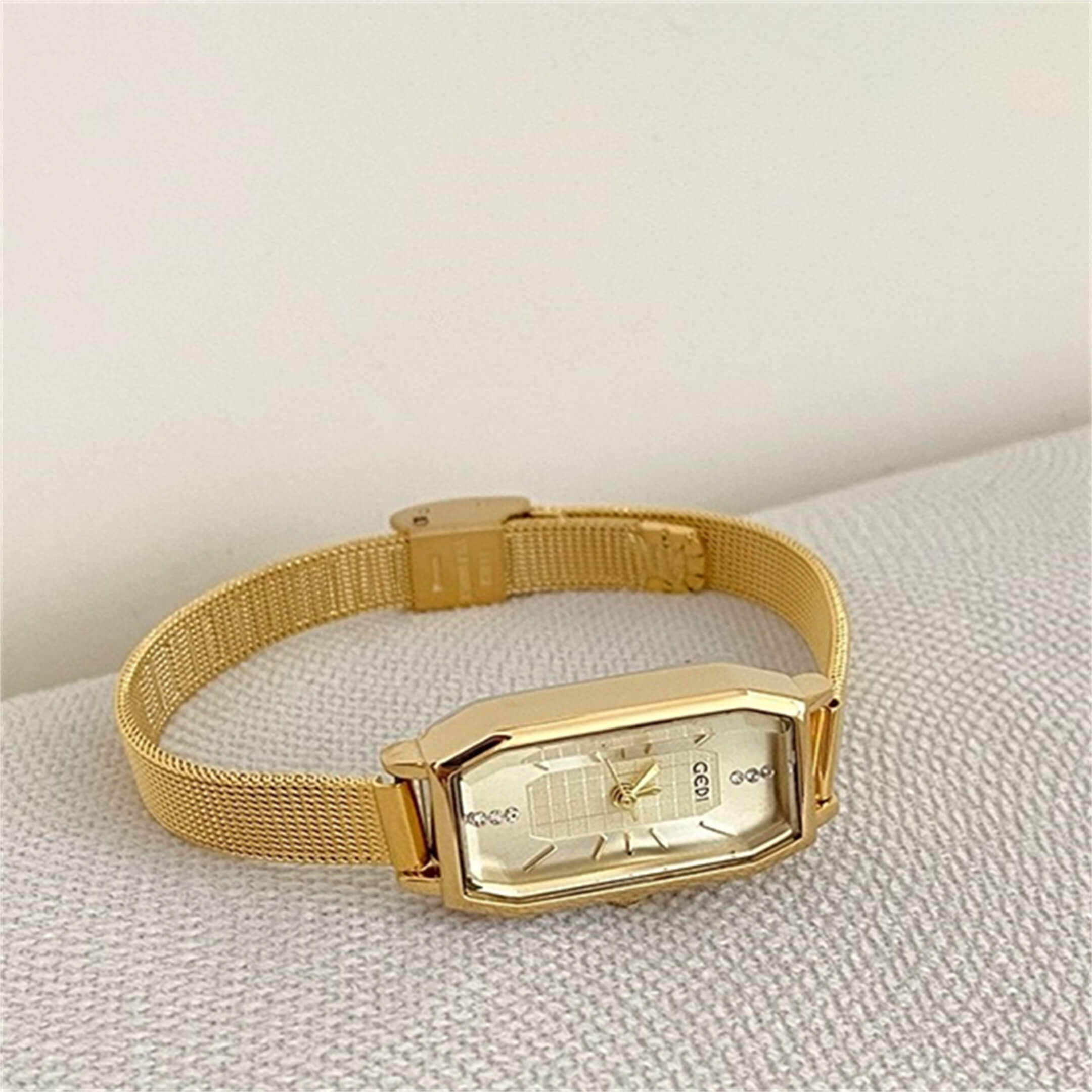 dainty gold watch