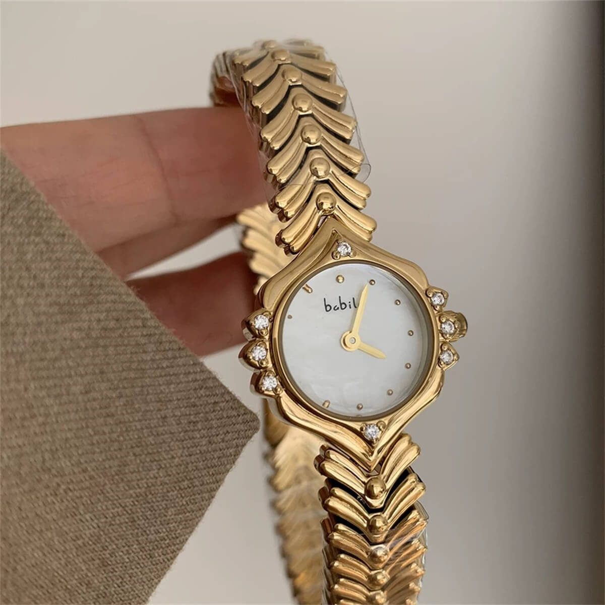 Vintage style pink face gold bracelet watch