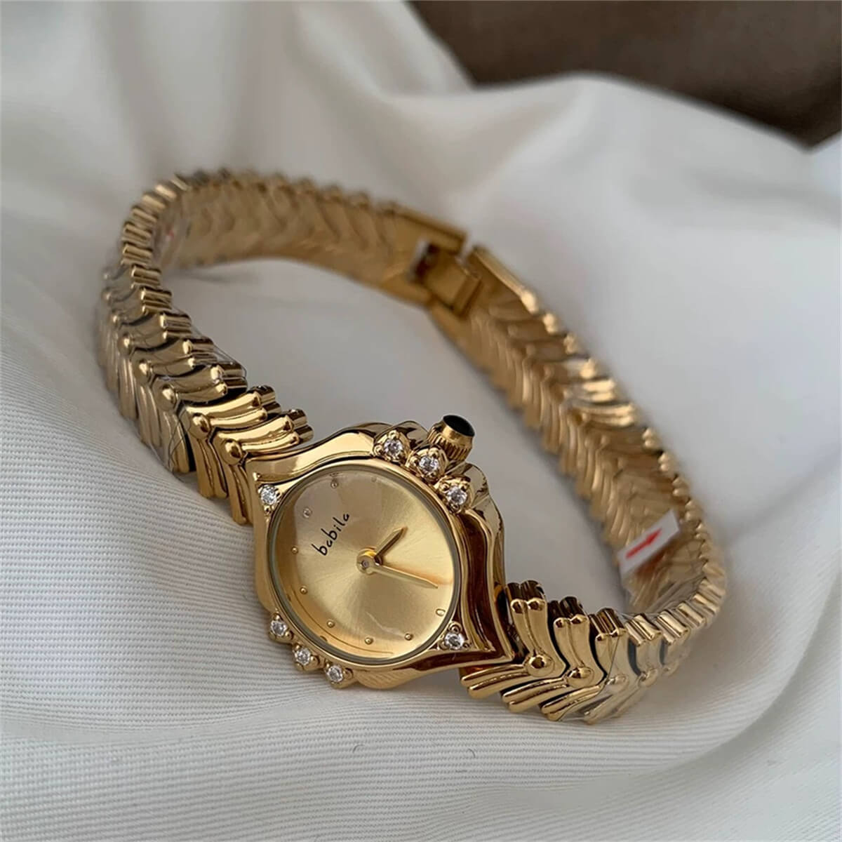 Vintage style pink face gold bracelet watch