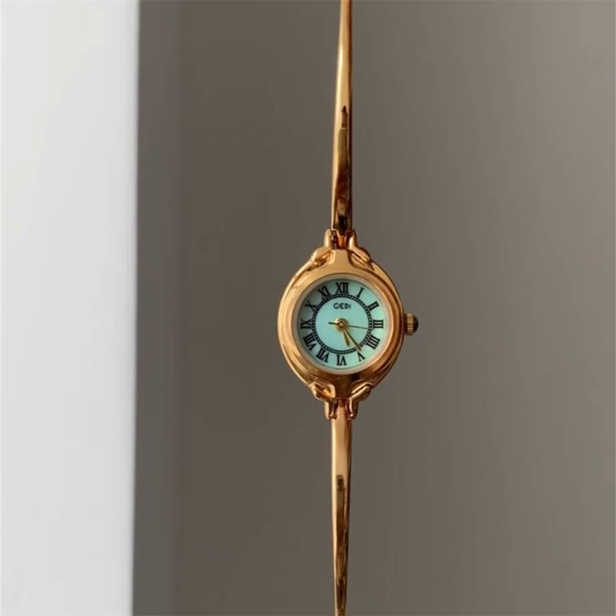 Round Face Gold Bracelet Watch