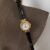 Dainty Mother of Pearl Round Face Black Leather Watch