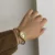 Vintage Gold Oval Watch for Women Roman Numeral Dial Bangle Watch
