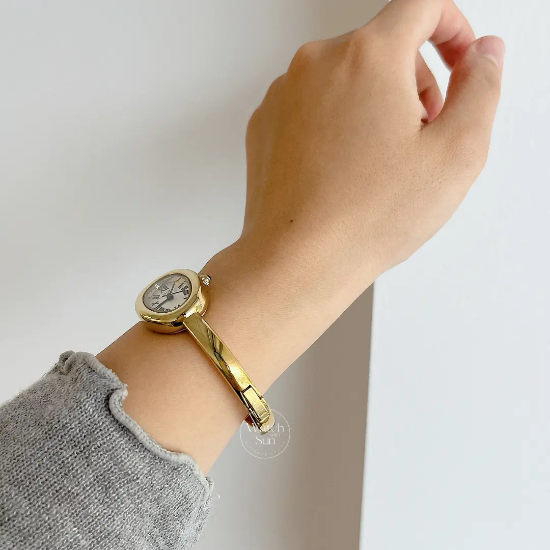 Vintage Gold Oval Watch Roman Numeral Dial Bangle Watch for Women