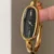 Elegant Oval Black Dial Wristwatch Gold Bangle Watch for Women
