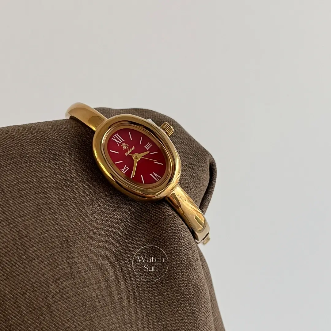 Chic Oval Burgundy Dial Gold Bangle Ladies Watch