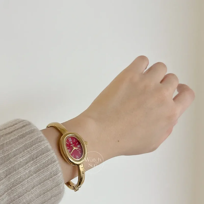 Chic Oval Burgundy Dial Gold Bangle Ladies Watch