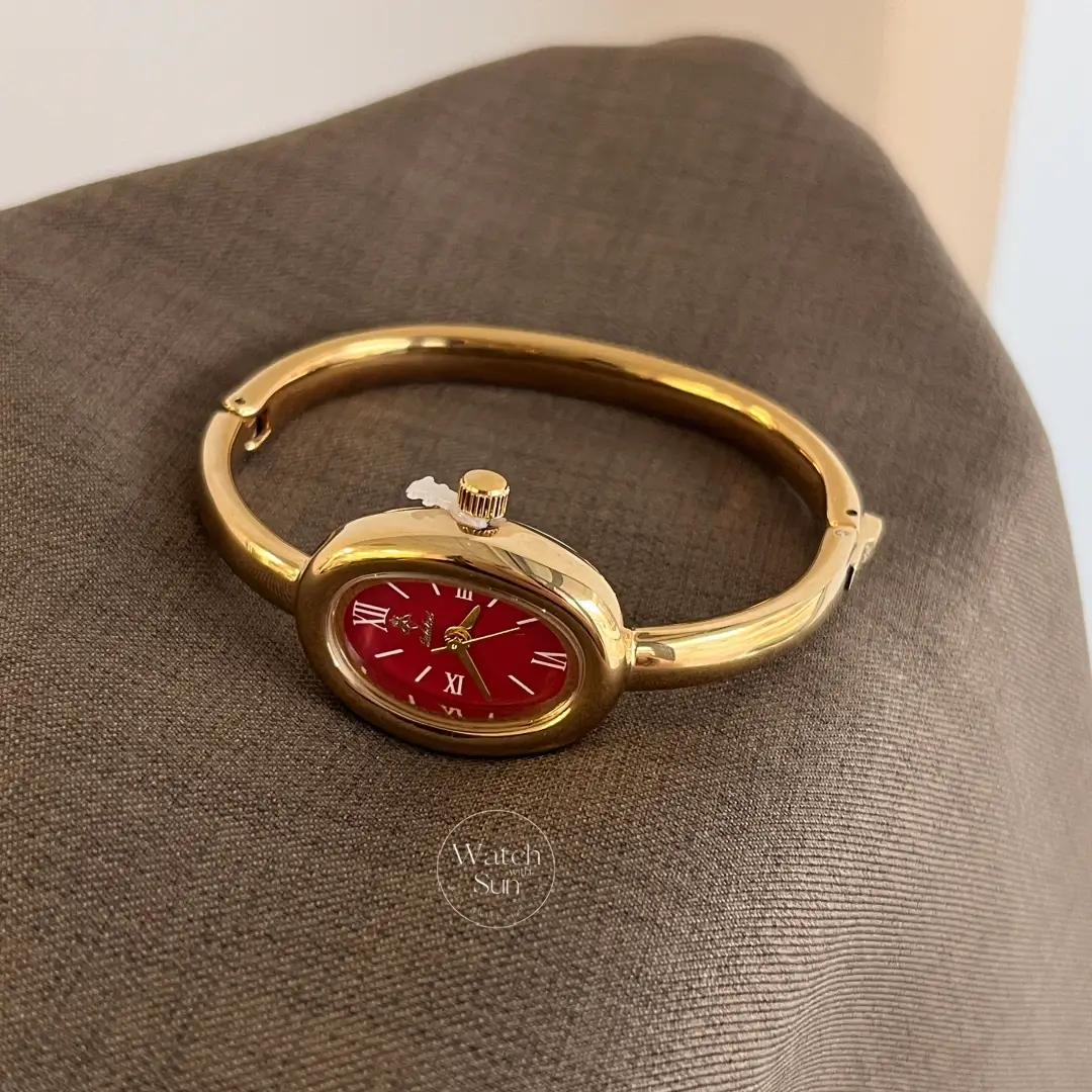 Chic Oval Burgundy Dial Gold Bangle Ladies Watch