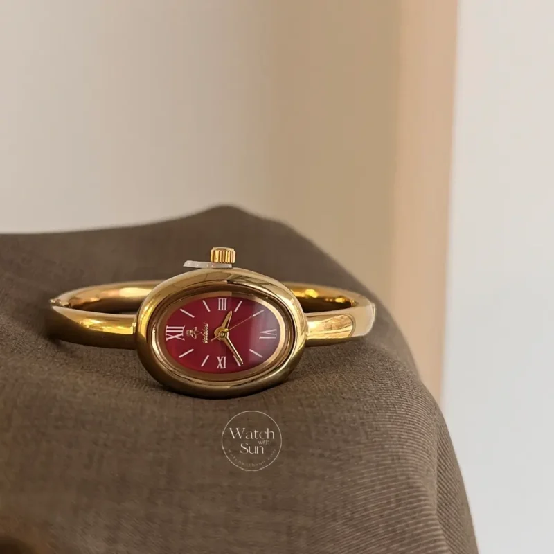 Chic Oval Burgundy Dial Gold Bangle Ladies Watch