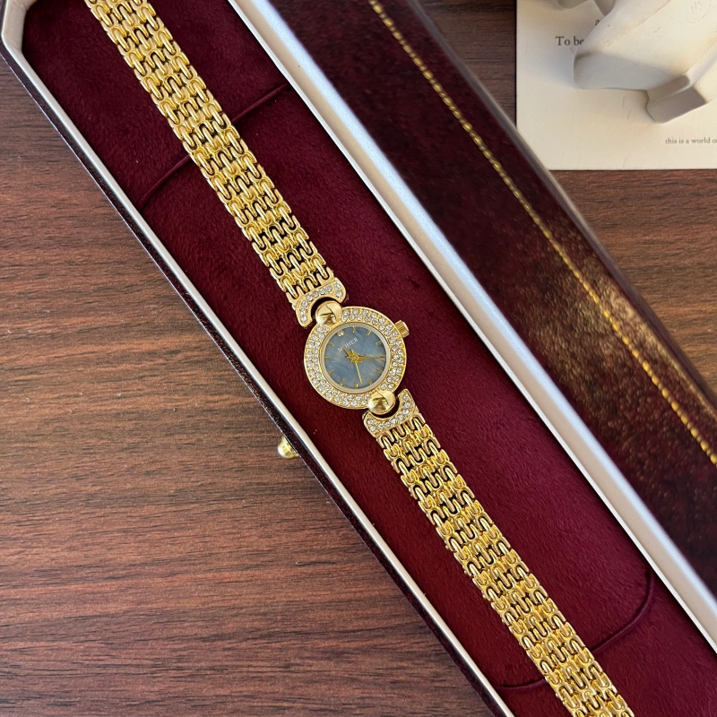 WWS 900.webp Elegant Blue Round Dial Gold Textured Bracelet Watch for Women