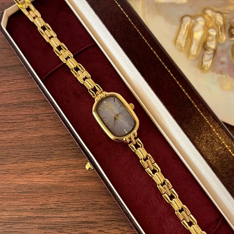 911.webp Purple Mother of Pearl Dial Gold Oval Bracelet Watch for Women