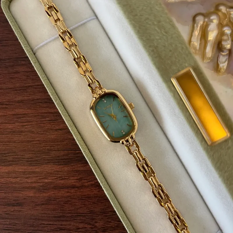 913.webp Mint Mother of Pearl Dial Gold Oval Bracelet Watch for Women