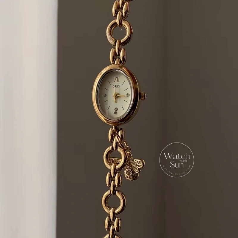 Elegant Gold Oval Bee Charm Bracelet Watch, Cream Dial Chain Link Wristwatc